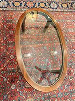 Top view showing oval wood frame and glass insert