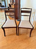 Front view of both chairs showing frames, upholstery, and overall condition