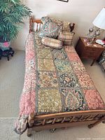 Top view of twin bed showing full bedding set and decorative pillows
