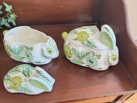 Large and small rabbit-shaped covered dishes showing lids removed and one assembled