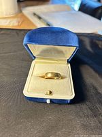 Ring in blue velvet box, lid open