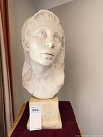 Front view of marble bust on base