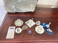 All ten crystal and glass pieces arranged on wooden surface
