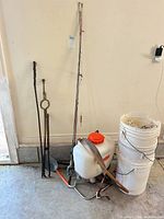 Full lot showing sprayer, rods, buckets, fenders and metal stakes