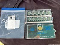 All coins in holder with zip bag visible