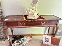 Full view of console table showing top, legs, drawer