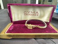 Watch in open Cyma Tavannes box