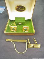 Full set inside Di Carlo box plus additional cufflinks and tie bar displayed