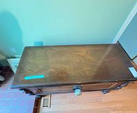 Top view showing dark brown finish and surface wear