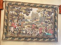 Full view of tapestry showing hunting scene and border