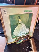 Framed print and tin plaque overall view