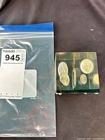 Cube beside labeled bag showing scale