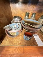 All pottery items grouped on shelf