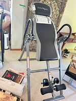Full view of Innova inversion table showing frame, backrest, handles and ankle holders