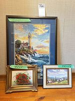 All three framed artworks standing together for scale and overview
