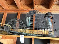 All four feeders and rope on shelf