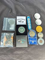 All items laid out showing variety of coins, tokens, packaging and presentation box