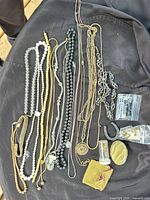 Entire assortment of necklaces, pendants, findings laid out