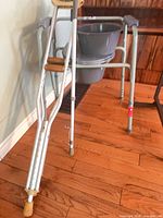 walker with bucket and crutches