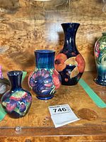 Front view showing all three Moorcroft vases