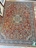 Full view of Oriental/Persian medallion rug showing overall pattern and colors