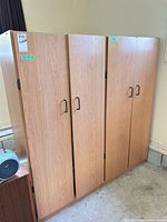 Front view of both matching laminate cabinets side by side