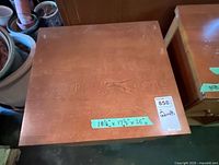 Top view of larger nightstand showing veneer finish and handwritten dimensions