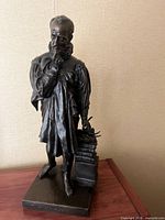 Full view of bronze figure on base