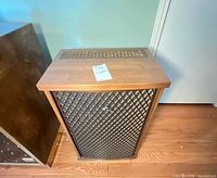 Front view showing lattice grille and cabinet