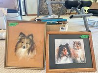 Both framed prints side by side with box of books behind