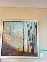 Full view of signed framed oil painting on wall