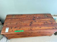Top view of cedar chest showing wood grain and hinges
