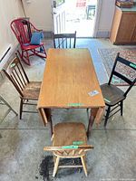 Top view of table and four assorted chairs