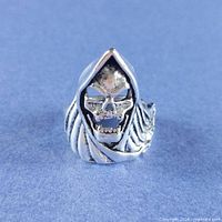 Front view of hooded skull ring