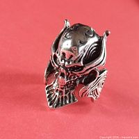 Front view of skull pile ring showing detailed face