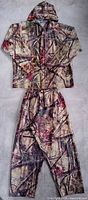 Oak Tree EVO camouflage rain suit laid flat showing jacket with hood and matching pants