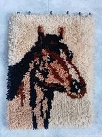 Full view of latch hook rug showing entire horse head design and hanging loops