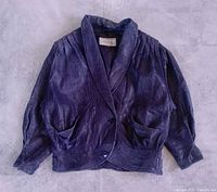 Front view of purple cropped leather jacket with puff shoulders and shawl collar