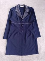 Front view of blazer-style dress showing overall design, buttons, lapels and waist trim