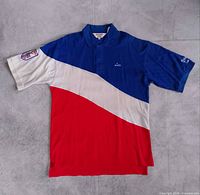 Front view showing full colorblock design, embroidered name, centennial patch, sleeve embroidery