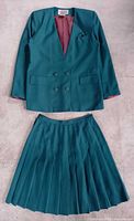 Full view of blazer and skirt laid flat