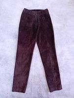 Front view of brown suede leather pants