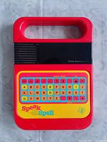 Front view showing Speak & Spell branding, keyboard layout and overall condition