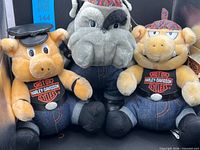 Group shot of bulldog and three pig plushes showing outfits, tags, size comparison