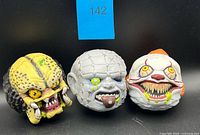 Front view of the three horror character squishy heads