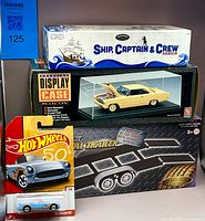 Front view of the four boxed/card items