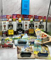 Group shot showing all Hot Wheels Character Cars and Kubri Cubes packs