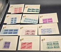Overview of majority of stamp blocks mounted on cards