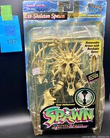 Front of sealed Exo-Skeleton Spawn figure on blister card