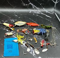 Group shot of full tackle assortment on black surface
